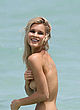 Joy Corrigan naked pics - topless photoshoot on beach