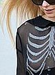 Avril Lavigne see-through to tits in public pics