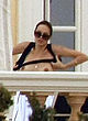 Angelina Jolie naked pics - shows her tits on the balcony