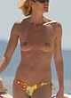 Elle Macpherson naked pics - showing tits on the beach