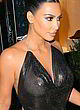 Kim Kardashian naked pics - being braless in a restaurant