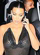 Kim Kardashian talking on phone & see-thru pics