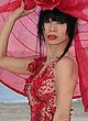 Bai Ling posing for a photoshoot in red pics