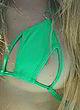 Avril Lavigne nip slip in a green bikini pics