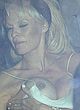 Pamela Anderson naked pics - flashing her big boob in car