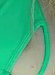 Avril Lavigne visible tits in green bikini pics