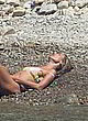 Heidi Klum lying and showing her boobs pics