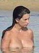 Penelope Cruz standing topless in water pics