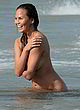 Chrissy Teigen topless in front of husband pics