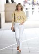 Mollie King yellow sweater and white jeans pics