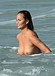 Chrissy Teigen naked pics - shows her sexy boobs in ocean