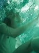 Milla Jovovich nude tits and ass in water pics