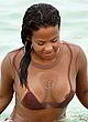Christina Milian naked pics - visible breast at the beach