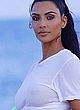 Kim Kardashian sheer white t-shirt on beach pics