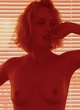 Amber Valletta posing topless in mag pics