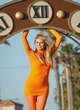Heidi Klum all-orange outfit on the set pics