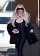 Khloe Kardashian shows her figure in a catsuit pics