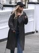 Rita Ora looks chic in a leather coat pics