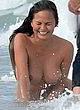 Chrissy Teigen nude boobs, beach photoshoot pics