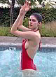 Alexandra Daddario naked pics - side-boob in a red swimsuit