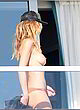 Heidi Klum naked pics - flashing her boobs on balcony