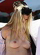 Lara Stone naked pics - topless at beach photocall