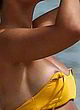 Frankie Bridge shows tits, yellow bikini top pics