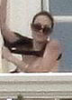 Angelina Jolie flashing her breasts, balcony pics