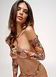 Emily Ratajkowski posing topless for her brand pics