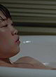 Andrea Chen shows her breasts in bathtub pics