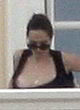 Angelina Jolie shows boobs on balcony pics