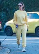 Lily James naked pics - casual in yellow sweatsuit