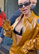 Kim Kardashian naked pics - shows cleavage in jumpsuit