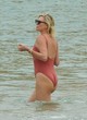 Charlize Theron sexy in a red swimsuit pics