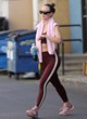 Olivia Wilde shows abs in maroon outfit pics