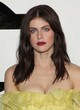 Alexandra Daddario shows cleavage in yellow dress pics