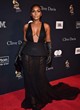 Janelle Monae shows cleavage in black dress pics