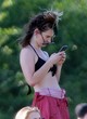 Lily James sunbathing in black bikini top pics
