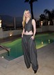 Elle Fanning posing in chic gray outfit pics