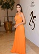 Eva Longoria posing in a orange dress pics