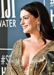 Anne Hathaway shows her bust in gold dress pics