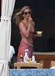 Jennifer Aniston models a black bikini top pics