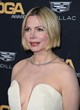 Michelle Williams shows her bust in gown pics