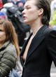 Milla Jovovich shows her small boob in public pics