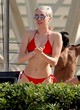 Miley Cyrus stuns in red bikini with frien pics