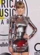 Taylor Swift posing in silver mini dress pics