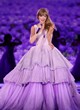Taylor Swift on stage in purple gown pics