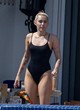 Miley Cyrus wows in black one-piece pics