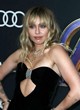 Miley Cyrus shows cleavage and abs in lbd pics