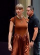 Taylor Swift stylish in rust satin dress pics